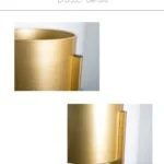 Close-up of a modern gold decorative vase, luxury home decor accessory.