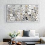 Modern luxury wall art with metallic accents in a stylish living room setting.