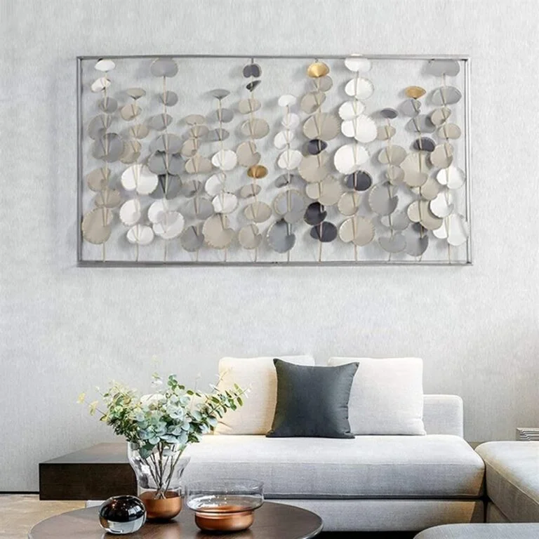 Modern luxury wall art with metallic accents in a stylish living room setting.