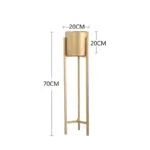 Gold metal planter stand, modern home decor accessory.