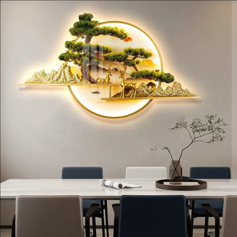 Illuminated wall art with tree and mountain design in a modern dining room.