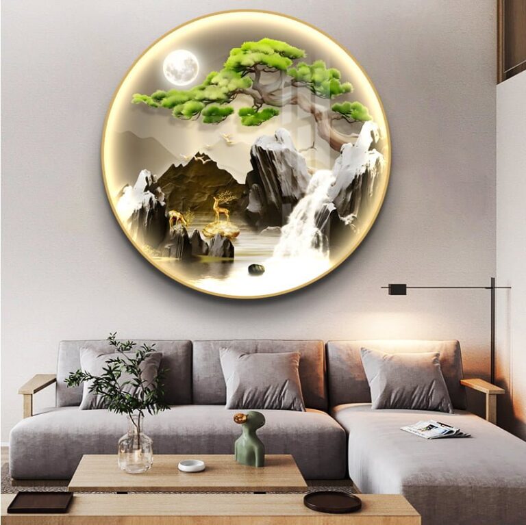 Illuminated round wall art with nature scene above modern sofa in living room.