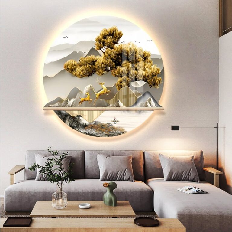 Modern illuminated wall art with nature scene above a stylish living room sofa.