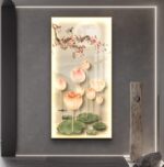 Illuminated floral wall art with lotus flowers and cherry blossoms on a modern grey wall.