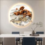 Illuminated modern wall art with nature scene above dining table, featuring LED lighting and decorative accents.