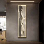 Modern illuminated wall art with abstract design in a luxury home setting.