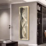 Modern illuminated wall art with abstract design in a luxury home setting.