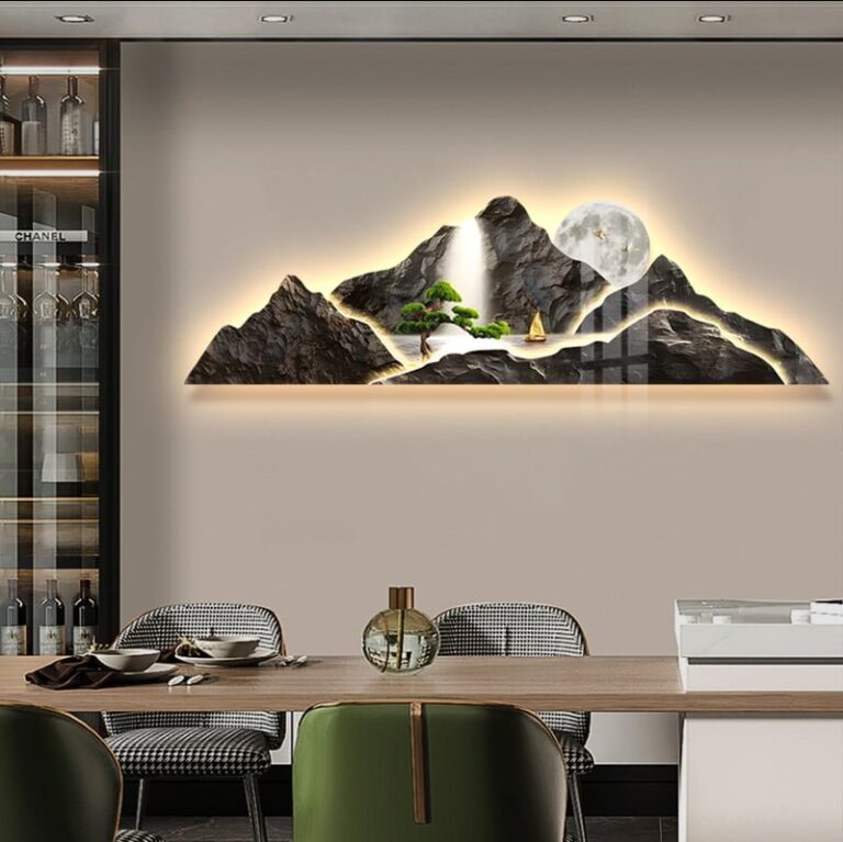 Illuminated mountain landscape wall art with LED lighting in a modern dining room.
