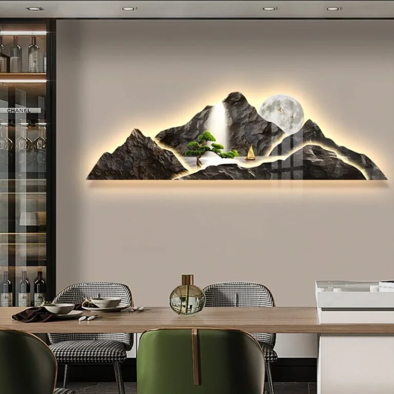 Illuminated mountain landscape wall art with LED lighting in a modern dining room.