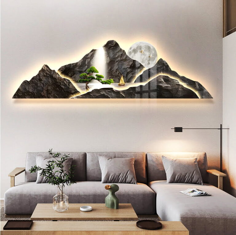 Illuminated mountain landscape wall art with LED lighting in a modern living room.