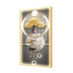 Illuminated wall art with golden tree and abstract design in aluminium frame.