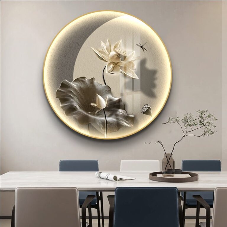 Illuminated round wall art with floral design in modern dining room.