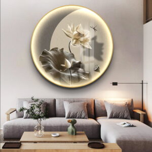 Illuminated round wall art with floral design in a modern living room setting.