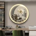 Illuminated round wall art with floral design in modern dining room.