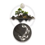 Modern illuminated wall art with tree and mountain design, featuring LED lights and circular elements.