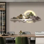 Modern illuminated wall art with mountain landscape and LED lighting in a luxury dining room.