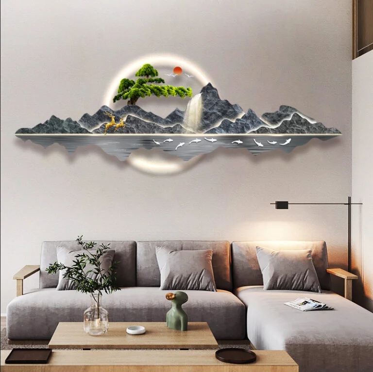 Modern illuminated wall art with mountain and waterfall design in a luxury living room.