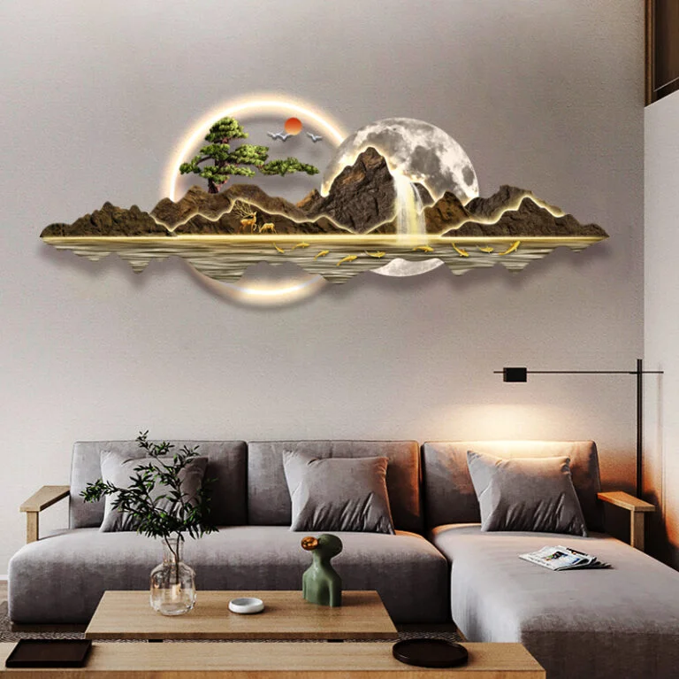 Modern illuminated wall art with mountain and tree design in a luxury living room setting.