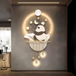 Illuminated wall art with panda design and celestial elements in a modern home setting.