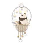 Modern decorative wall art with a panda, stars, and moon in a circular design.