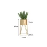 Gold metal planter with green plant, modern home decor accessory.