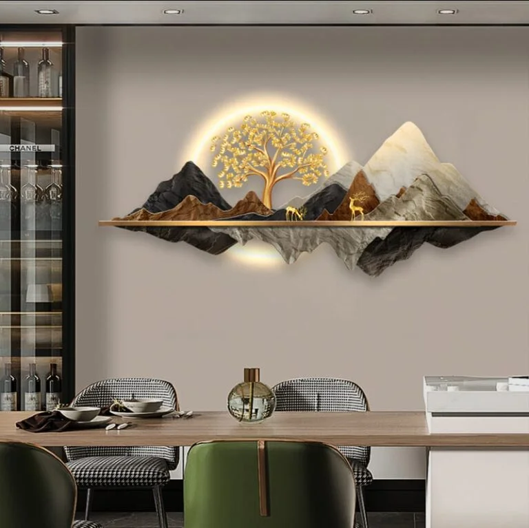 Illuminated mountain and tree wall art in modern dining room setting.