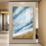 Modern abstract wall art with blue and gold tones in a luxury home setting.