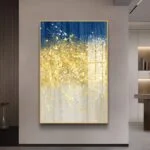 Modern luxury wall art with gold and blue abstract design in a living room setting.