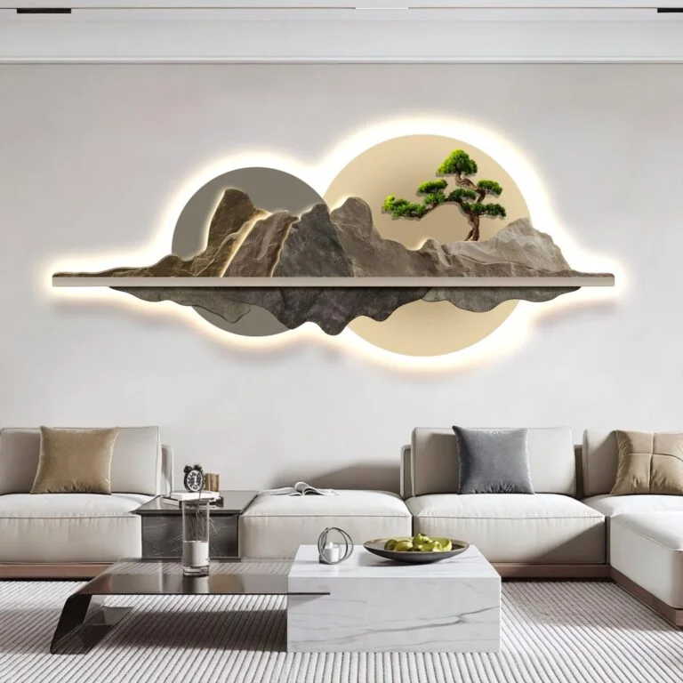 Modern illuminated wall art with mountain and tree design in a luxury living room.