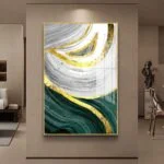 Modern abstract wall art with gold, green, and white swirls in a luxurious living room setting.
