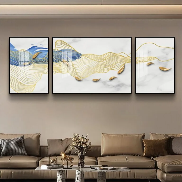Modern luxury wall art with gold and blue abstract design in a living room setting.