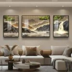 Modern living room with framed landscape wall art and neutral decor.