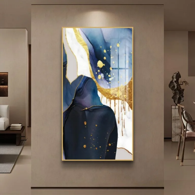 Modern abstract wall art with gold accents in a luxury living room setting.