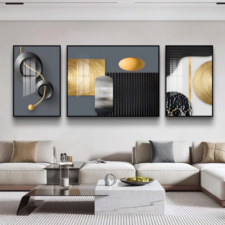 Modern luxury wall art set with abstract designs in a contemporary living room.