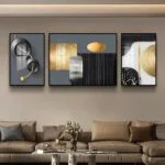 Modern luxury wall art set with abstract designs in a living room setting.
