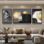 Modern luxury wall art in a living room with abstract designs and neutral tones.