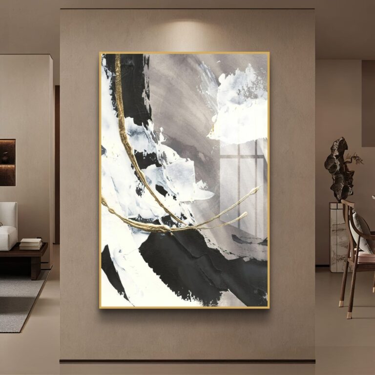 Modern abstract wall art with gold accents in a luxury living room setting.