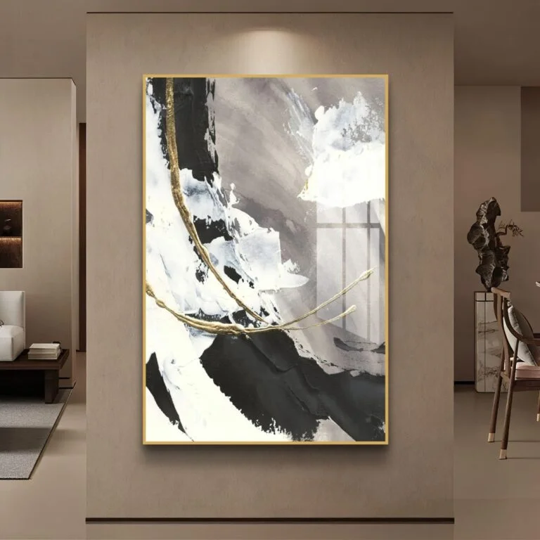Modern abstract wall art with gold accents in a luxury living room setting.