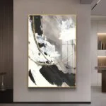 Modern abstract wall art with gold accents in a luxury home setting.