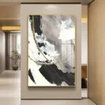 Modern abstract wall art with gold accents in a luxury home interior setting.