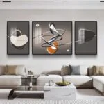 Modern living room with abstract framed wall art and contemporary decor.