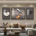 Modern living room with abstract framed wall art and neutral decor.