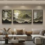 Modern living room with three-panel framed wall art depicting a serene mountain landscape.