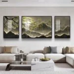 Modern living room with triptych mountain landscape wall art and elegant decor.