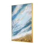 Modern abstract wall art with blue and gold tones in a gold frame.