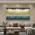 Modern luxury wall art with gold and blue abstract design in a living room setting.