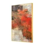 Modern abstract wall art with vibrant red and earthy tones in a gold frame.