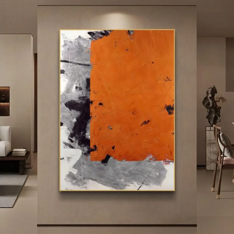 Modern abstract wall art with orange and gray tones in a luxury home setting.