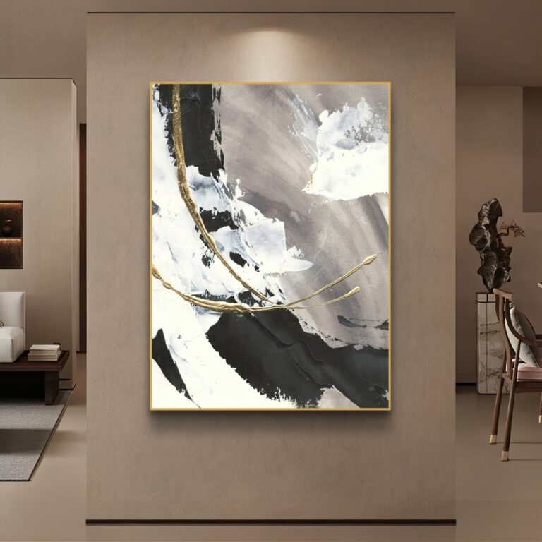 Modern abstract wall art with gold accents in a luxury living room setting.