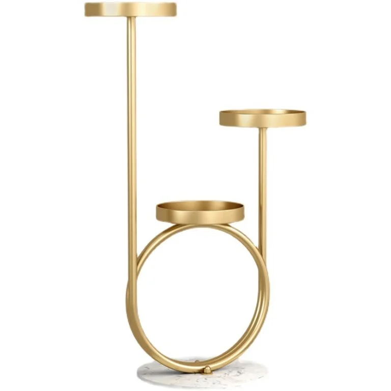 Modern gold decorative stand with circular design and marble base for home decor.